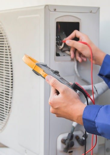 HVAC technician performing maintenance in a commercial building in Los Angeles.